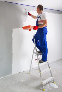 Painter painting the wall